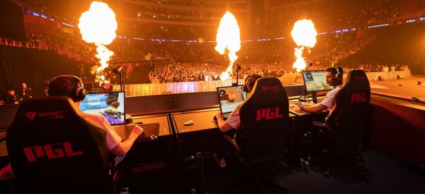 The illuminated PGL Major Antwerp 2022 live‑stage with multiple camera rigs